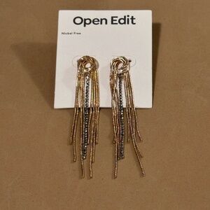 Open Edit multi-metal knot long earrings.